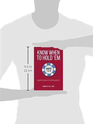 Person holding book titled 'Know When to Hold 'Em' with dimensions shown.